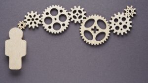 a small human figure with gears representing executive functions