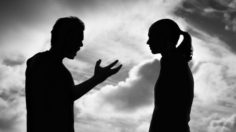 a shadowy image of two people arguing - depicting adhd and relationships