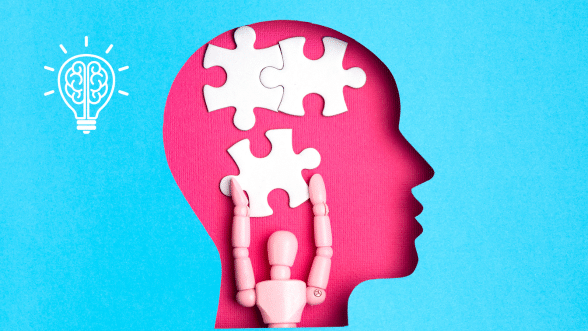 Brain puzzle pieces in a pink silhouette, symbolizing neurotypical and neurodivergent learning styles.