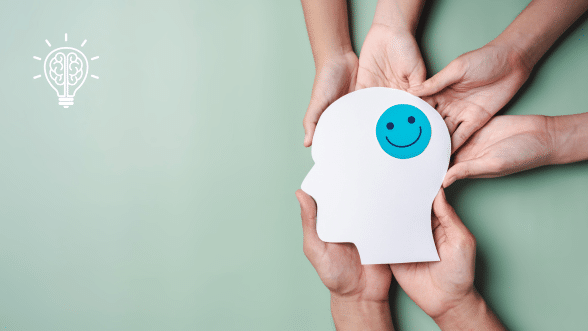 Hands holding up a head with a smiley face, symbolizing heightened situational awareness and collaboration.